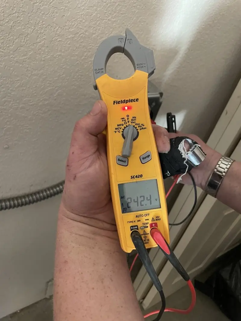 Voltage testing with clamp meter during Ceiling Fan Installation in Montclair
